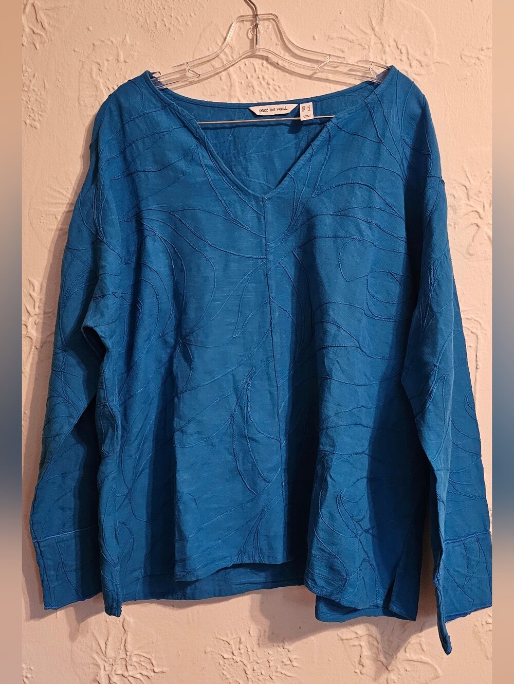 Peace Love World Embroidered V Neck Long Sleeve Top